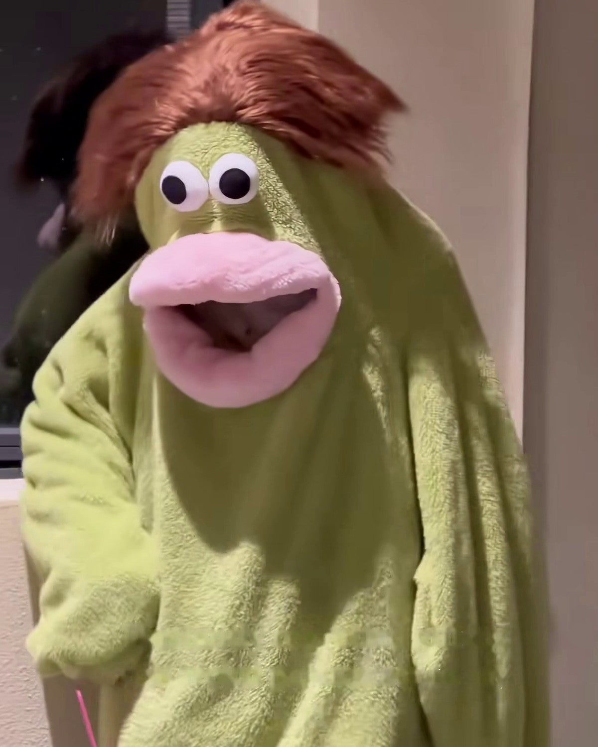 Big Mouth Monster onesie worn at home